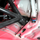 Settings for the rear suspension stick up next to the rearmost bars of the roll cage.